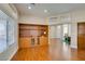 Living room with hardwood floors, an open concept and a built-in shelving unit at 9816 Gerald Ct, Las Vegas, NV 89134