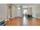 Spacious living room with wood floors, a dining area, and ample natural light at 9816 Gerald Ct, Las Vegas, NV 89134