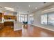 Living room featuring hardwood floors and views into the updated kitchen with a breakfast nook at 9816 Gerald Ct, Las Vegas, NV 89134