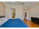 Well-lit main bedroom with ensuite bathroom and hardwood floors at 9816 Gerald Ct, Las Vegas, NV 89134