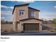 Modern two-story home with a two-car garage and desert landscaping in a sunny location at 1409 Brady Bay Pl # 110, North Las Vegas, NV 89084