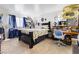 Bedroom featuring a large window and dark furniture set at 1455 E Katie Ave # A21, Las Vegas, NV 89119