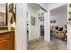 Hallway featuring mirror closet doors, view of living room, and view of the bathroom at 1455 E Katie Ave # A21, Las Vegas, NV 89119