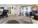 Image shows a wide view of a combination living and dining area with carpeting and natural light at 1455 E Katie Ave # A21, Las Vegas, NV 89119