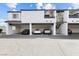 Image shows a condominium with parking spots under the units and stairs leading to the second floor at 1455 E Katie Ave # A21, Las Vegas, NV 89119