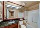 Clean bathroom featuring granite counters, large mirror and tile shower at 210 E Flamingo Rd # 326, Las Vegas, NV 89169