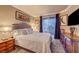Comfortable bedroom with a plush bed, ample natural light, and a private balcony at 210 E Flamingo Rd # 326, Las Vegas, NV 89169