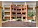 Stunning building facade with a fountain and expertly landscaped courtyard at 210 E Flamingo Rd # 326, Las Vegas, NV 89169