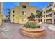 Intricate landscaping in building courtyard with mature shrubbery and trees at 210 E Flamingo Rd # 326, Las Vegas, NV 89169