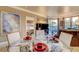Open-concept dining and living area with stylish furniture and natural light at 210 E Flamingo Rd # 326, Las Vegas, NV 89169