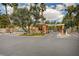 Inviting entrance gate with mature landscaping at 210 E Flamingo Rd # 326, Las Vegas, NV 89169