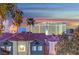 Charming building showcasing blue and white tones, complemented by a well-maintained tile roof and palm trees at 210 E Flamingo Rd # 326, Las Vegas, NV 89169