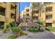 Beautiful building exterior with manicured landscaping and stair access at 210 E Flamingo Rd # 326, Las Vegas, NV 89169