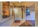 Charming front entryway with decorative tile, sidelight and sconce lighting at 210 E Flamingo Rd # 326, Las Vegas, NV 89169