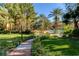 Expansive landscaped community grounds with swimming pool and mature trees at 210 E Flamingo Rd # 326, Las Vegas, NV 89169