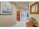 Hallway with stackable washer/dryer and decorative wall art at 210 E Flamingo Rd # 326, Las Vegas, NV 89169