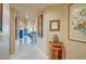 Bright hallway with tile floor and decorative art leads to an open floorplan at 210 E Flamingo Rd # 326, Las Vegas, NV 89169