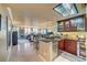 Open kitchen with stainless steel appliances and granite countertops overlooking living area at 210 E Flamingo Rd # 326, Las Vegas, NV 89169
