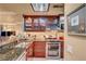 Modern kitchen includes stainless steel appliances, granite countertops, and custom wood cabinetry at 210 E Flamingo Rd # 326, Las Vegas, NV 89169