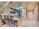 Modern kitchen features stainless appliances, granite countertops, and a breakfast bar with seating at 210 E Flamingo Rd # 326, Las Vegas, NV 89169