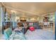 Bright living area with mirrored walls, a leather couch, dining area, and unique decorative touches at 210 E Flamingo Rd # 326, Las Vegas, NV 89169