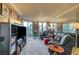 Spacious living room with a large sectional couch, shelving unit, and access to an outdoor balcony at 210 E Flamingo Rd # 326, Las Vegas, NV 89169