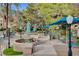 Outdoor dining area in a park-like setting adjacent to the community pool at 210 E Flamingo Rd # 326, Las Vegas, NV 89169