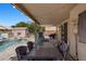 Charming backyard features a covered patio, pool, dining set, and storage shed at 2199 Maple Shade St, Henderson, NV 89002