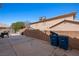 Spacious backyard featuring a block wall, patio, and storage shed at 2199 Maple Shade St, Henderson, NV 89002
