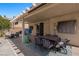 The covered patio overlooks a pool and yard, perfect for relaxation and gatherings at 2199 Maple Shade St, Henderson, NV 89002