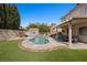 Expansive backyard features a pool, patio, shed, and lush green lawn at 2199 Maple Shade St, Henderson, NV 89002