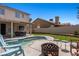 Backyard with a pool, patio area, and outdoor seating, perfect for relaxing and entertaining at 2199 Maple Shade St, Henderson, NV 89002