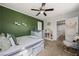 Cozy bedroom featuring an accent wall, comfortable furniture, and stylish decor at 2199 Maple Shade St, Henderson, NV 89002