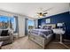 Spacious bedroom featuring two large windows, natural light, and a comfortable sitting area at 2199 Maple Shade St, Henderson, NV 89002