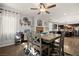 Bright dining area with a stone fireplace, modern decor, and an open layout to the kitchen at 2199 Maple Shade St, Henderson, NV 89002