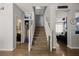 Inviting entryway with staircase, hardwood floors, and open access to living spaces at 2199 Maple Shade St, Henderson, NV 89002