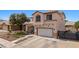 Two-story home featuring tile roof, two-car garage and desert landscaping at 2199 Maple Shade St, Henderson, NV 89002
