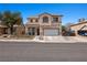 Charming two-story home featuring a well-manicured front yard and a spacious two-car garage at 2199 Maple Shade St, Henderson, NV 89002