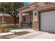 Charming home featuring a covered porch, manicured lawn and convenient garage access at 2199 Maple Shade St, Henderson, NV 89002