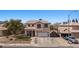 Two-story home with a tile roof, desert landscaping, and extended driveway at 2199 Maple Shade St, Henderson, NV 89002