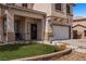 Inviting front exterior with manicured lawn, covered porch, and attached garage at 2199 Maple Shade St, Henderson, NV 89002