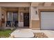 Charming front porch with dark wood door, and manicured front yard at 2199 Maple Shade St, Henderson, NV 89002