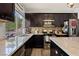 Well-equipped kitchen with modern appliances and stone countertops at 2199 Maple Shade St, Henderson, NV 89002