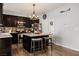 Bright kitchen with a central island, stainless steel appliances, and a stylish backsplash at 2199 Maple Shade St, Henderson, NV 89002