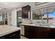Kitchen featuring stone countertops, stainless steel appliances, and slider to outdoor space at 2199 Maple Shade St, Henderson, NV 89002