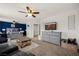 Cozy living room with a large TV, comfortable seating, and stylish decor at 2199 Maple Shade St, Henderson, NV 89002