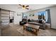 Inviting living room with a comfortable sofa, natural light, and modern decor at 2199 Maple Shade St, Henderson, NV 89002