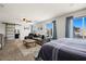 A large main bedroom with windows, comfortable seating, and modern decor at 2199 Maple Shade St, Henderson, NV 89002