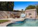 Backyard pool area featuring seating, shed, and blue tiled pool border at 2199 Maple Shade St, Henderson, NV 89002