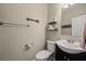 Well-lit powder room with modern fixtures, decorative shelves, and a stylish vanity at 2199 Maple Shade St, Henderson, NV 89002
